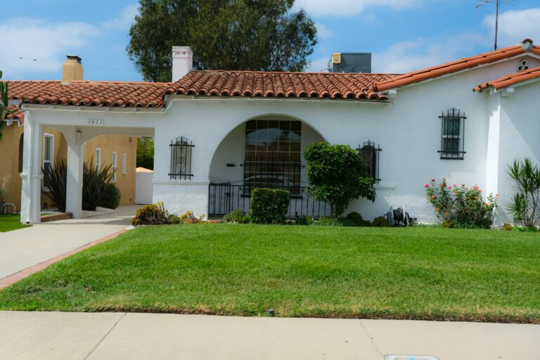 Newer white stucco home with a red tile roof, ready for an 11-month builder warranty inspection in Arizona