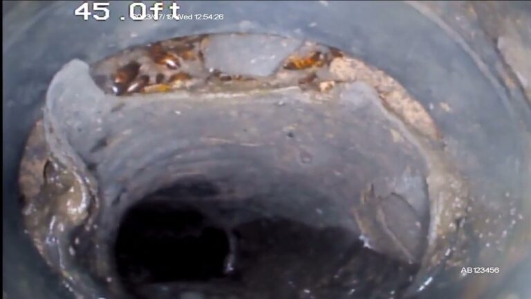 Sewer camera footage of a broken and flattened sewer pipe in an older Arizona home